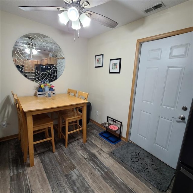 1525 Duncan St, Saint Joseph, MO 64503 - dining area with wood finished floors, ceiling fan, and baseboards