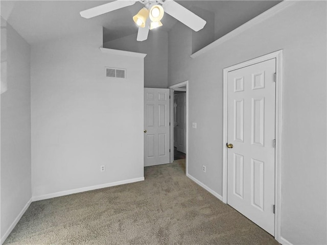 18100 E 11th Terrace Ct N, Independence, MO 64056 - unfurnished bedroom with carpet flooring, baseboards, high vaulted ceiling, and ceiling fan