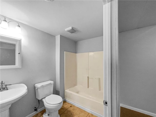 18100 E 11th Terrace Ct N, Independence, MO 64056 - full bath with toilet, a sink, tile patterned floors, and baseboards