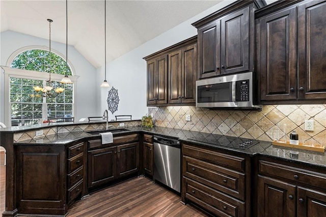 16904 S Bradley Dr, Olathe, KS 66062 - kitchen with stainless steel appliances, dark wood finished floors, vaulted ceiling, a chandelier, and a peninsula