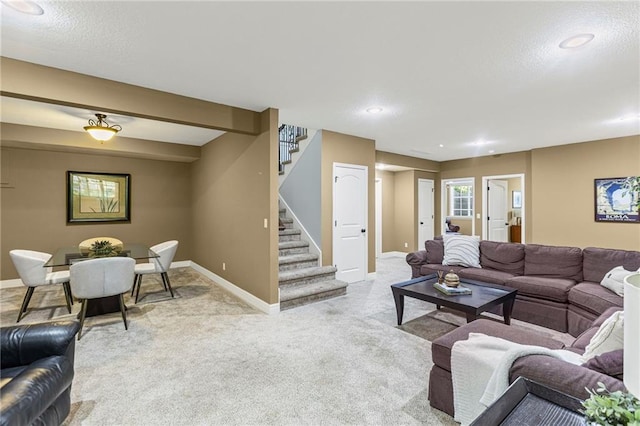 16904 S Bradley Dr, Olathe, KS 66062 - carpeted living room with stairway and a textured ceiling