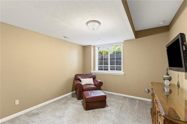 16904 S Bradley Dr, Olathe, KS 66062 - sitting room featuring a textured ceiling and carpet flooring