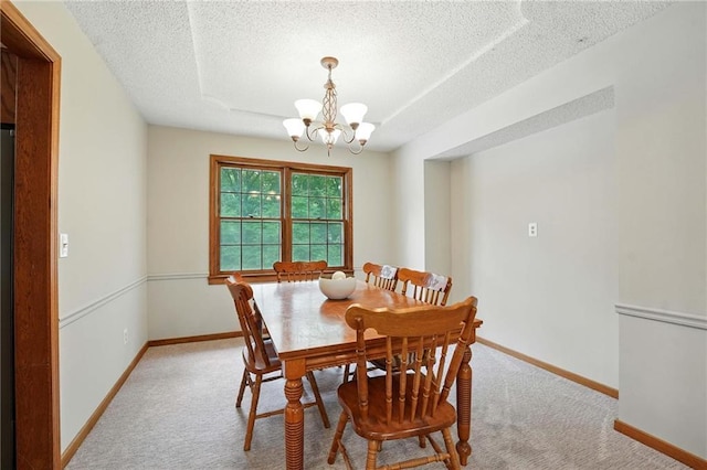 8025 Woodstone St, Lenexa, KS 66219 - dining area with a textured ceiling, light carpet, and a chandelier