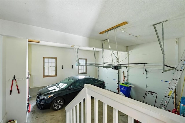 8025 Woodstone St, Lenexa, KS 66219 - garage featuring a garage door opener