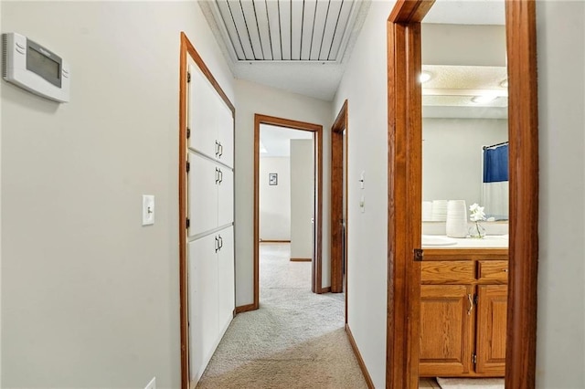 8025 Woodstone St, Lenexa, KS 66219 - hallway with light colored carpet and attic access
