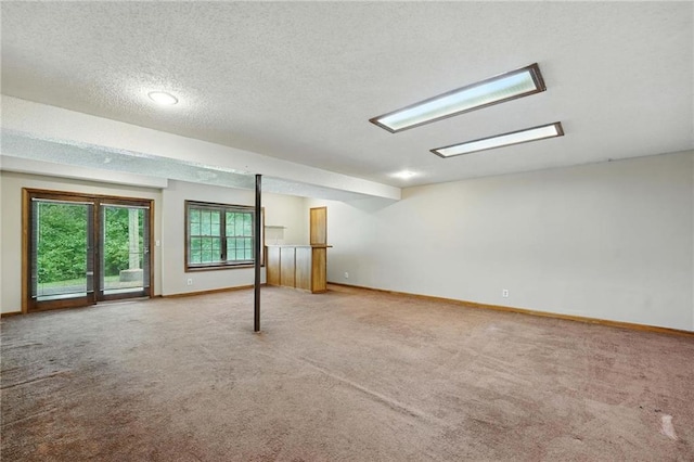 8025 Woodstone St, Lenexa, KS 66219 - below grade area with carpet flooring and a textured ceiling