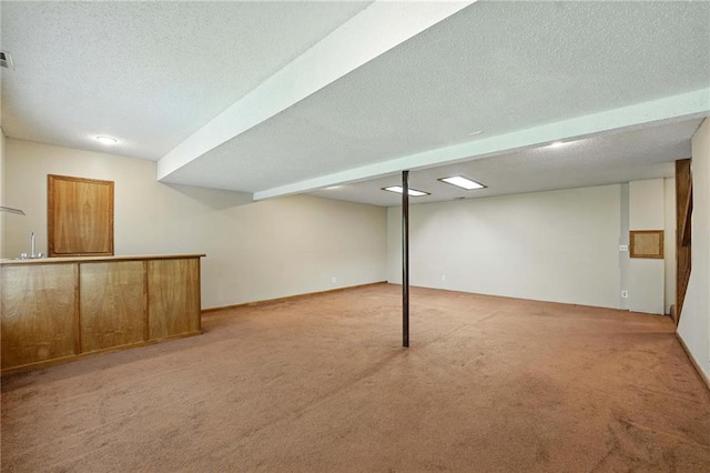 8025 Woodstone St, Lenexa, KS 66219 - finished below grade area featuring carpet flooring, a textured ceiling, and bar area