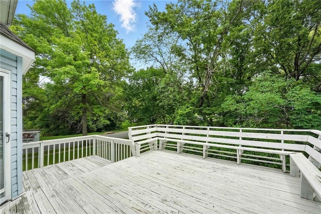 8025 Woodstone St, Lenexa, KS 66219 - wooden terrace featuring view of scattered trees