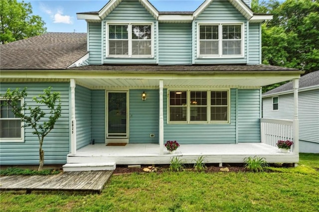 8025 Woodstone St, Lenexa, KS 66219 - back of property with covered porch and a lawn