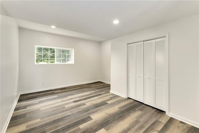 20105 Crestone St, Spring Hill, KS 66083 - unfurnished bedroom featuring recessed lighting, wood finished floors, baseboards, and a closet