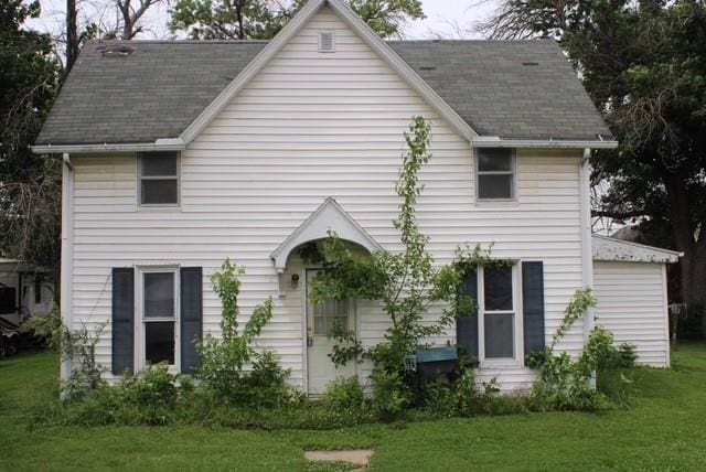 214 S Central Ave, Ravenwood, MO 64479 - rear view of property with a lawn