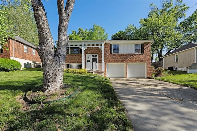 17108 Hart Ave, Independence, MO 64055 - split foyer home featuring brick siding, a front lawn, and driveway