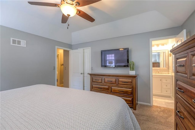 15005 W 94th St, Lenexa, KS 66215 - bedroom with light carpet, ensuite bath, and ceiling fan