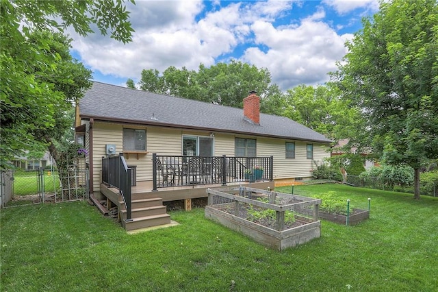 15005 W 94th St, Lenexa, KS 66215 - rear view of house with a vegetable garden, a wooden deck, a chimney, and roof with shingles