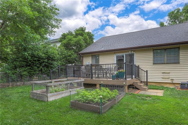 15005 W 94th St, Lenexa, KS 66215 - rear view of property with a garden, a deck, and a shingled roof