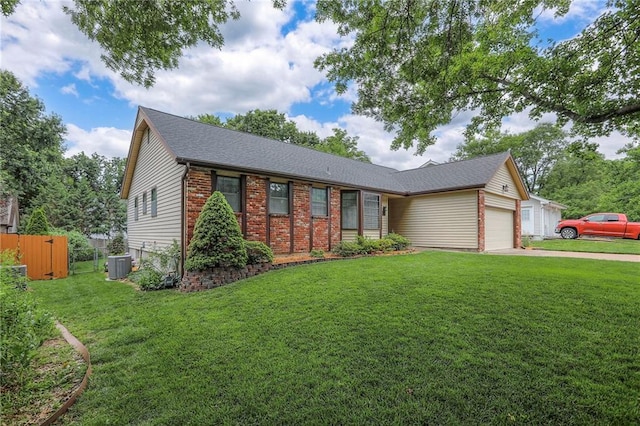 15005 W 94th St, Lenexa, KS 66215 - single story home featuring a garage, concrete driveway, brick siding, and roof with shingles