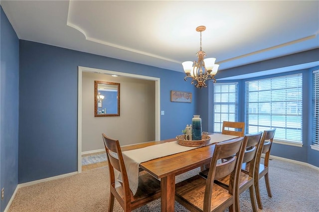15005 W 94th St, Lenexa, KS 66215 - dining space featuring light colored carpet, a chandelier, and a tray ceiling