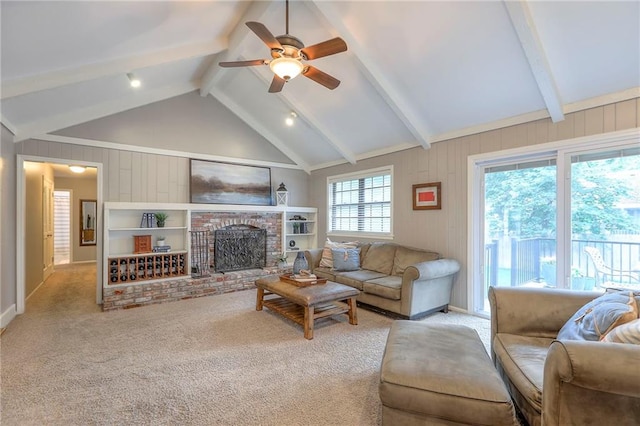 15005 W 94th St, Lenexa, KS 66215 - carpeted living area with ceiling fan, a brick fireplace, and wooden walls