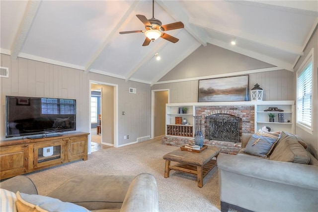 15005 W 94th St, Lenexa, KS 66215 - carpeted living room with a fireplace, a ceiling fan, and wooden walls