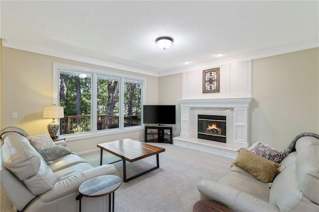 7642 N Atkins Pl, Kansas City, MO 64152 - living area featuring ornamental molding, carpet floors, a tiled fireplace, and a textured ceiling