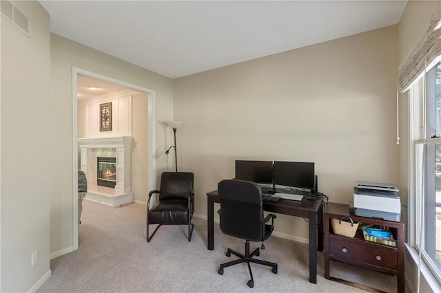 7642 N Atkins Pl, Kansas City, MO 64152 - office featuring carpet floors and a tiled fireplace