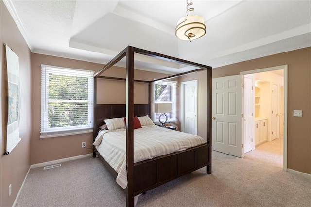 7642 N Atkins Pl, Kansas City, MO 64152 - bedroom with light colored carpet, a tray ceiling, and ornamental molding