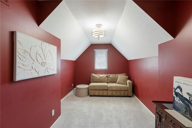 7642 N Atkins Pl, Kansas City, MO 64152 - living room with carpet flooring, lofted ceiling, and a textured ceiling