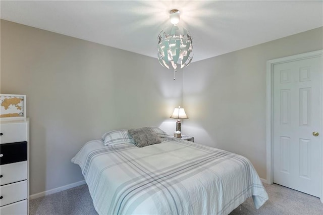 7642 N Atkins Pl, Kansas City, MO 64152 - bedroom featuring light carpet and a chandelier