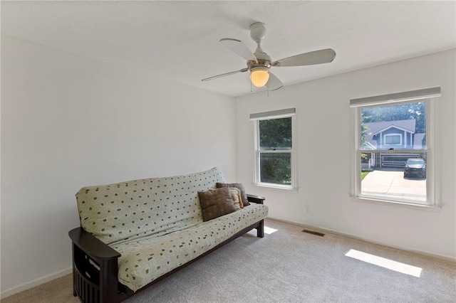 7642 N Atkins Pl, Kansas City, MO 64152 - sitting room featuring carpet floors, plenty of natural light, and a ceiling fan