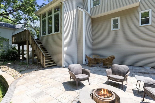 7642 N Atkins Pl, Kansas City, MO 64152 - view of patio featuring an outdoor fire pit and stairs