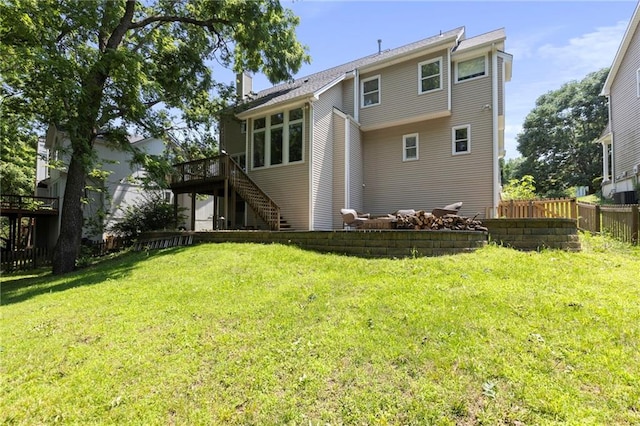 7642 N Atkins Pl, Kansas City, MO 64152 - back of house with stairway, a deck, and a chimney