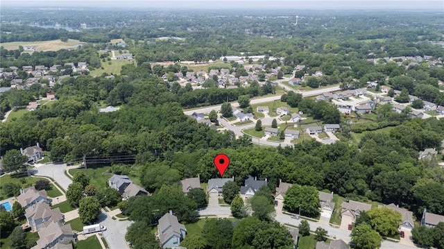 7642 N Atkins Pl, Kansas City, MO 64152 - aerial view of property and surrounding area featuring nearby suburban area