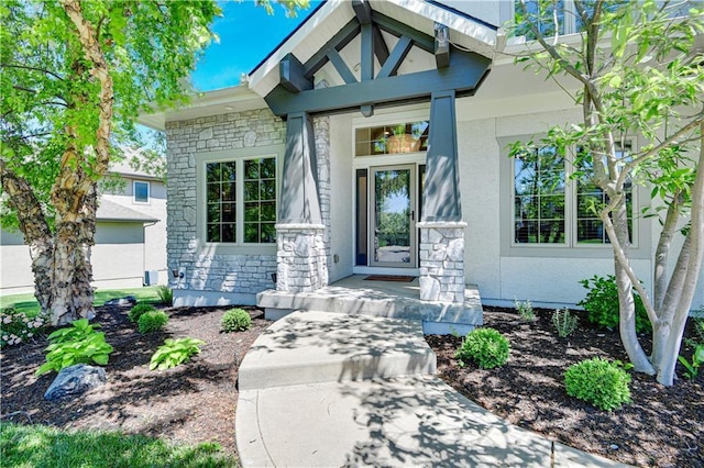 16821 Goddard St, Overland Park, KS 66221 - property entrance with stone siding, stucco siding, and a porch