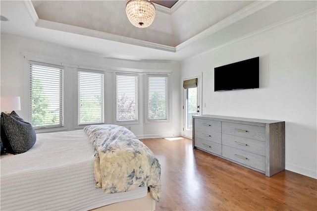 16821 Goddard St, Overland Park, KS 66221 - bedroom with a raised ceiling, light wood-style flooring, ornamental molding, and baseboards