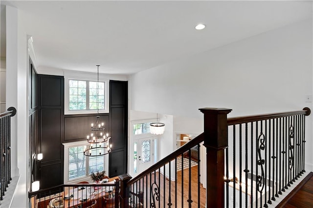 16821 Goddard St, Overland Park, KS 66221 - corridor with an upstairs landing, a chandelier, wood finished floors, and recessed lighting