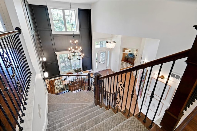 16821 Goddard St, Overland Park, KS 66221 - stairs featuring a chandelier and a high ceiling