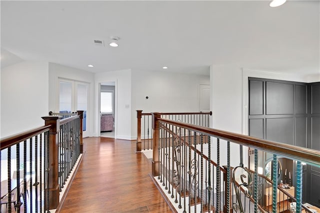 16821 Goddard St, Overland Park, KS 66221 - hall with an upstairs landing, wood finished floors, recessed lighting, and baseboards