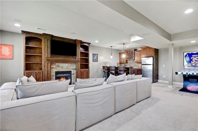 16821 Goddard St, Overland Park, KS 66221 - living room featuring recessed lighting, a fireplace, light colored carpet, and baseboards