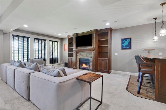16821 Goddard St, Overland Park, KS 66221 - living area with recessed lighting, light carpet, a glass covered fireplace, and baseboards