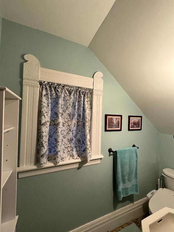 308 E Arrow St, Marshall, MO 65340 - bathroom with toilet, vaulted ceiling, and baseboards
