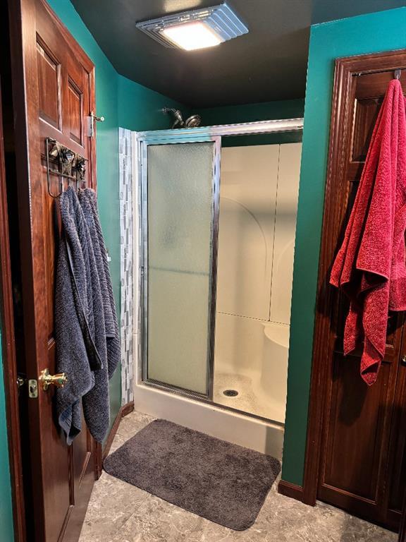 308 E Arrow St, Marshall, MO 65340 - bathroom featuring a stall shower