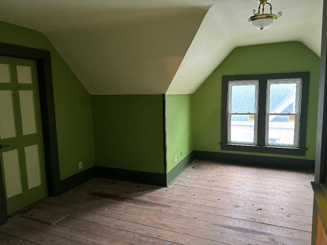 308 E Arrow St, Marshall, MO 65340 - additional living space featuring lofted ceiling, hardwood / wood-style floors, and baseboards