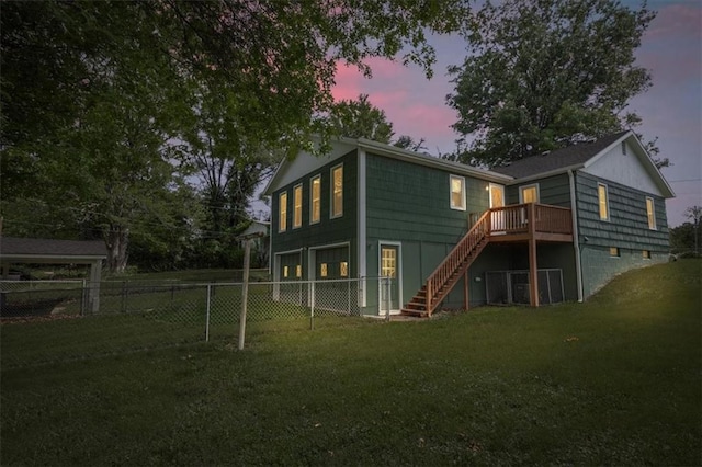 6608 N Edison Ave, Kansas City, MO 64151 - back of property at dusk featuring stairway and a wooden deck