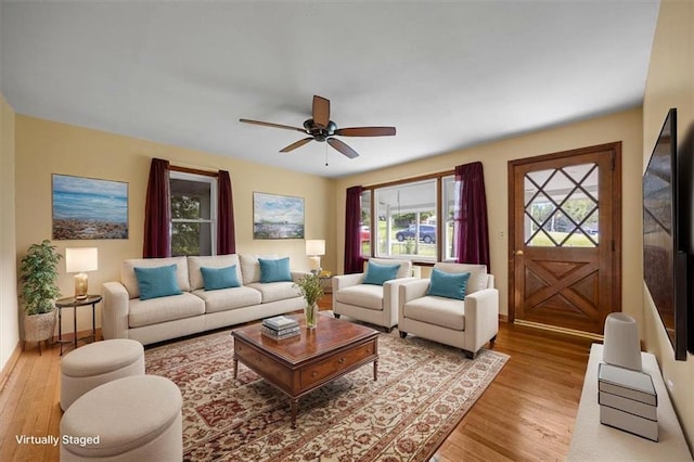 6608 N Edison Ave, Kansas City, MO 64151 - living area featuring light wood-style flooring and a ceiling fan