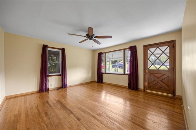 6608 N Edison Ave, Kansas City, MO 64151 - unfurnished room featuring light wood-style flooring, a ceiling fan, and baseboards