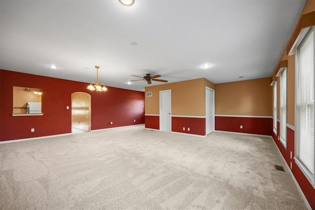 6608 N Edison Ave, Kansas City, MO 64151 - unfurnished living room featuring carpet floors, a ceiling fan, arched walkways, baseboards, and recessed lighting
