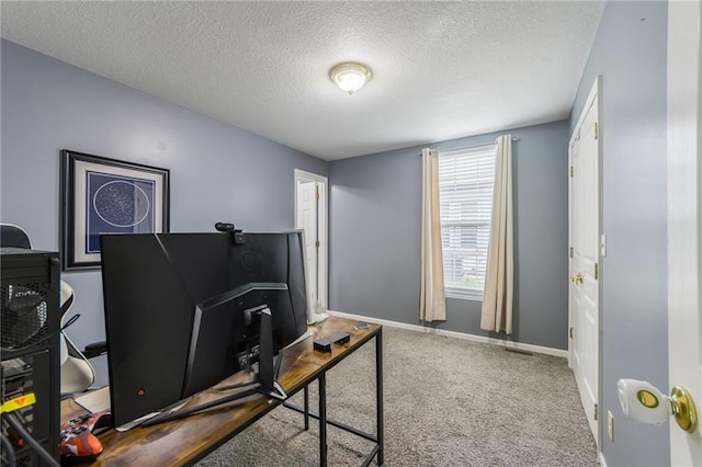 124 Wildwood St, Excelsior Springs, MO 64024 - carpeted office space with a textured ceiling and baseboards