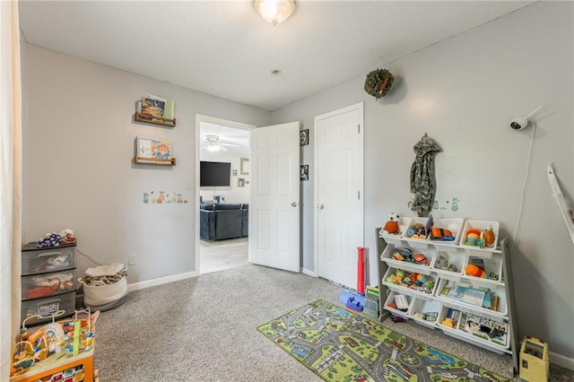 124 Wildwood St, Excelsior Springs, MO 64024 - recreation room with carpet floors and baseboards
