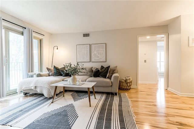 3606 Gillham Rd Unit 25, Kansas City, MO 64111 - living area with light wood-style floors and baseboards