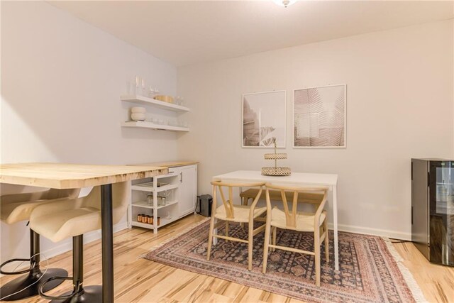 3606 Gillham Rd Unit 25, Kansas City, MO 64111 - dining room featuring wood finished floors and baseboards